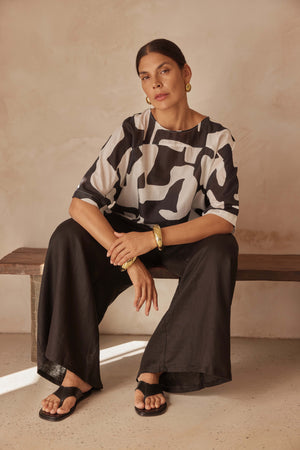 Tirelli blouse chic tailored feminine modern versatile top