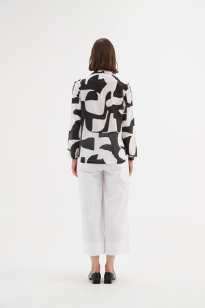 Tirelli cropped blouse soft feminine chic neutral style