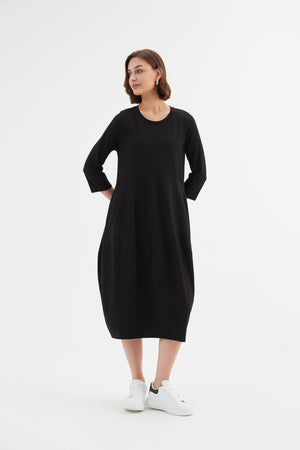 Tirelli women’s classic coat minimalist seasonal layering
