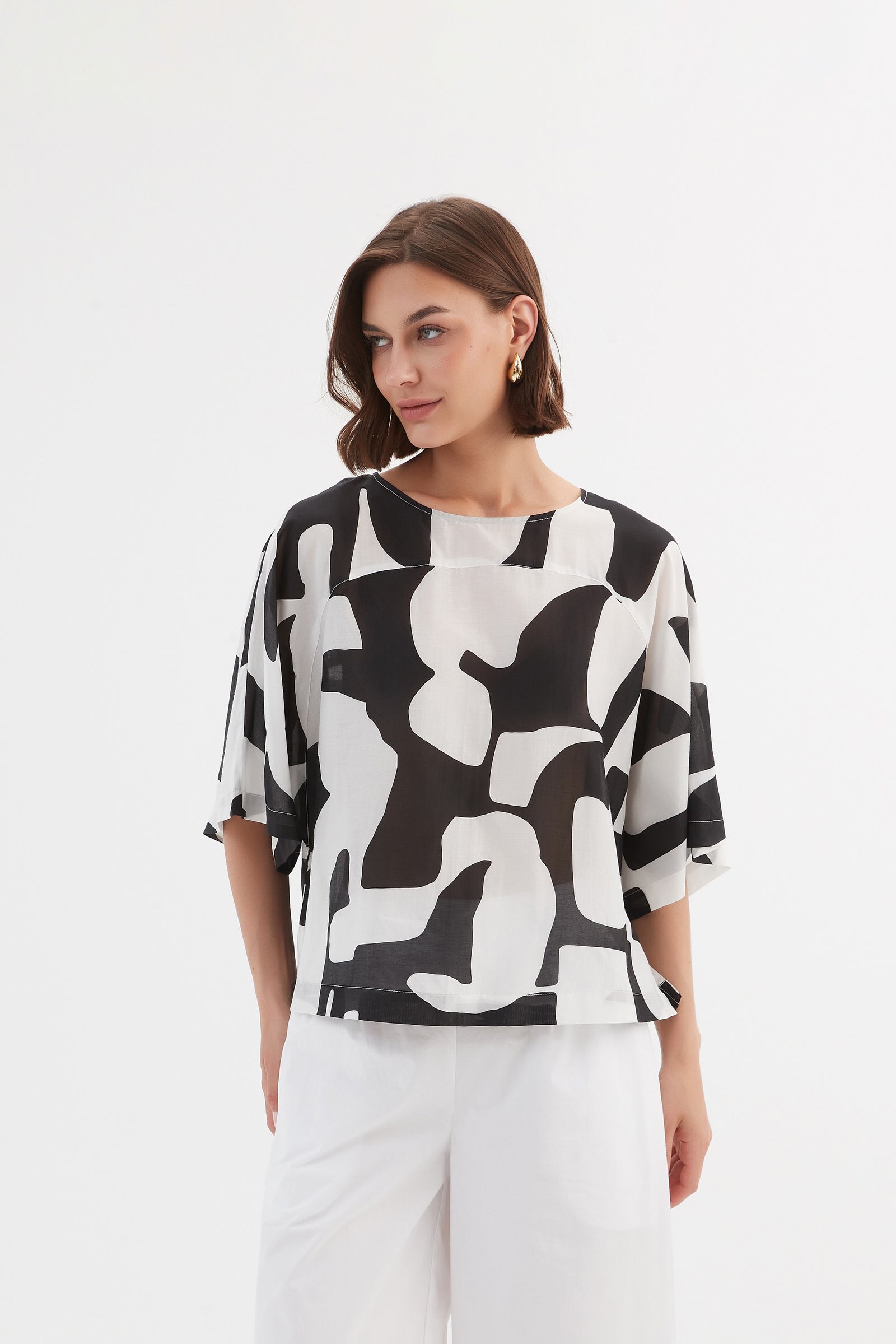 Tirelli cropped blouse chic versatile feminine modern style