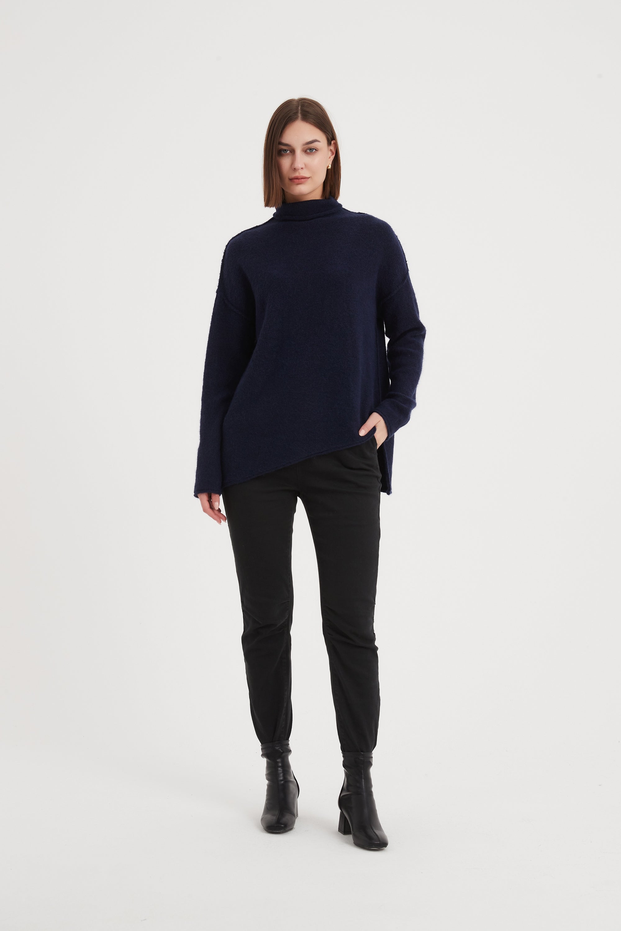 EXPOSED SEAM FUNNEL NECK KNIT