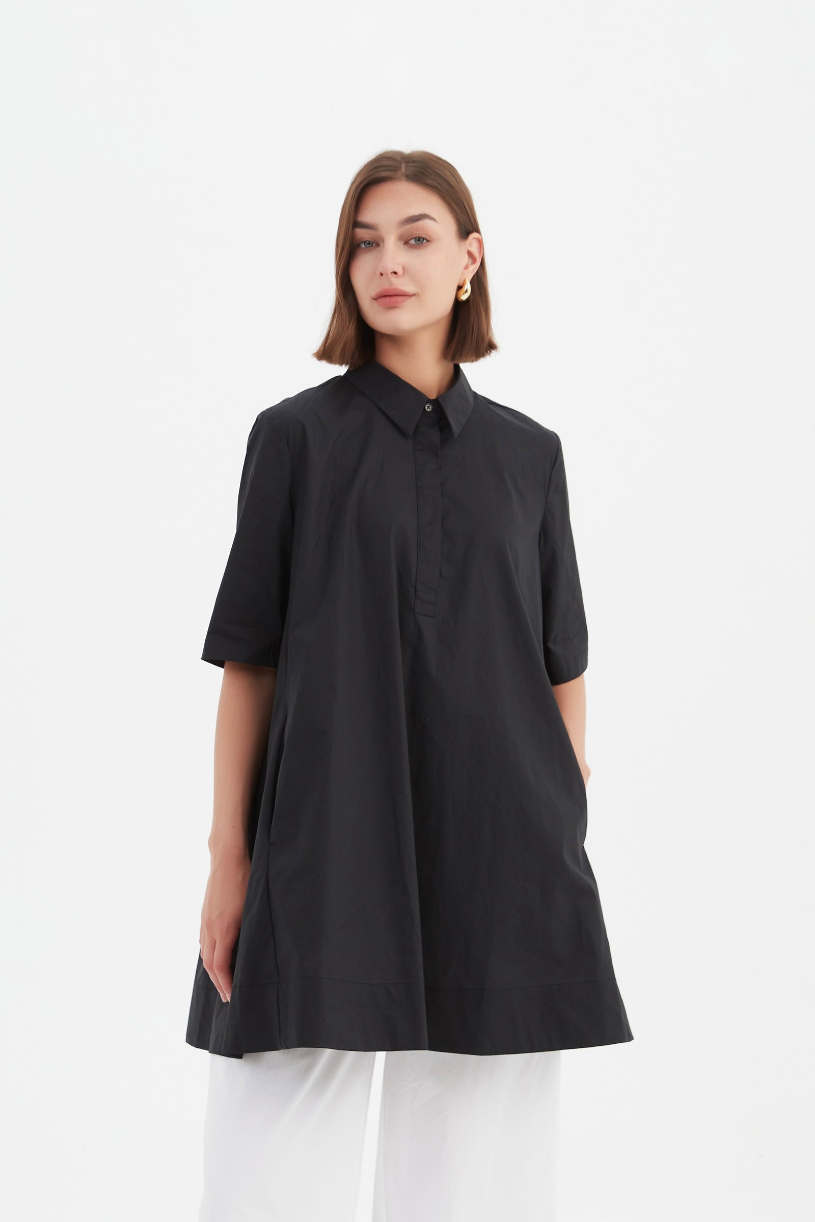 TUCK BACK SWING SHIRT