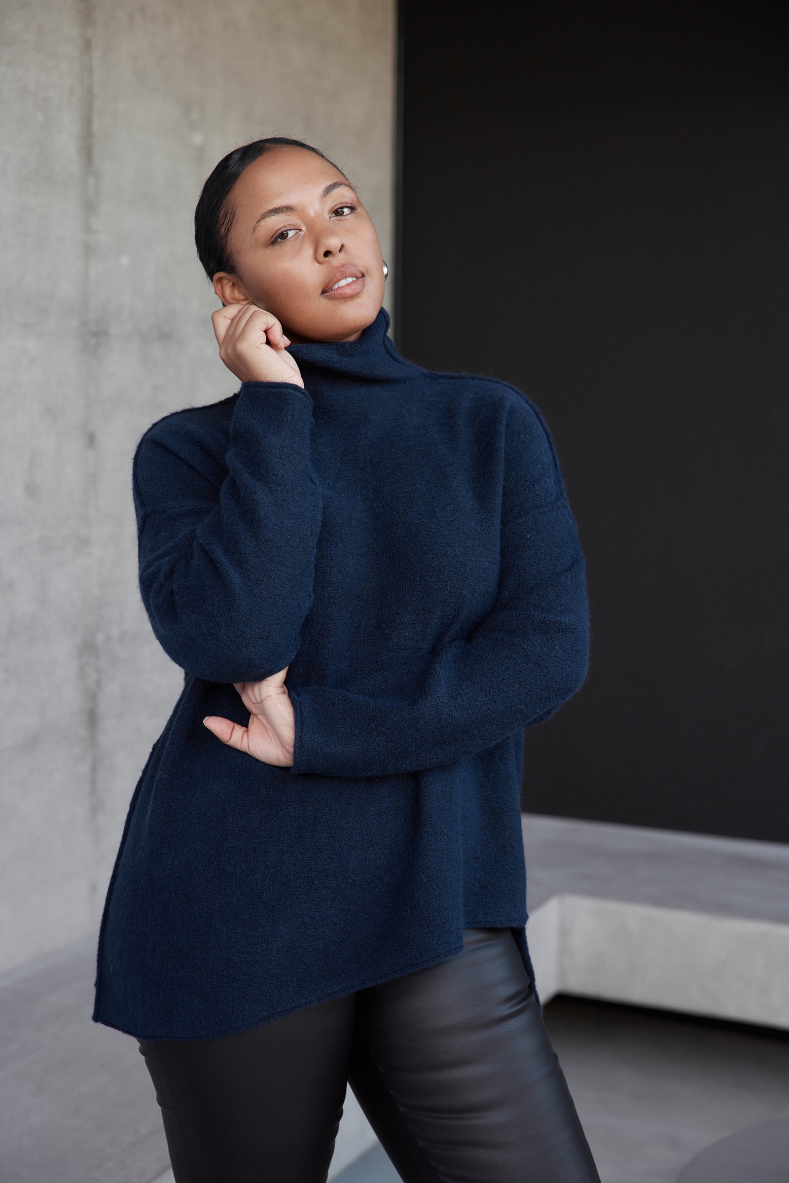 EXPOSED SEAM FUNNEL NECK KNIT